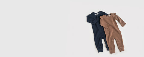 Fall baby clothes collection featuring organic cotton pieces in autumn colors