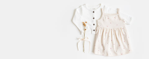Baby in soft organic cotton dress, comfortable and stylish