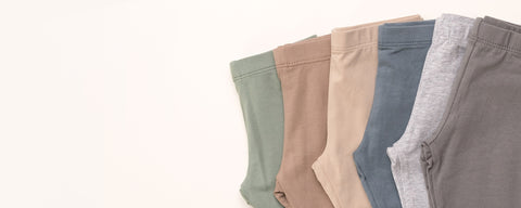 Organic cotton baby leggings and pants in various colors for active toddlers and infants