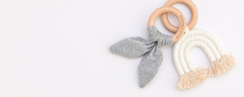 Newborn teethers and baby rattles collection featuring natural wood and silicone teething toys