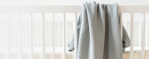 Organic cotton swaddle blankets in muslin and knit textures for newborn comfort