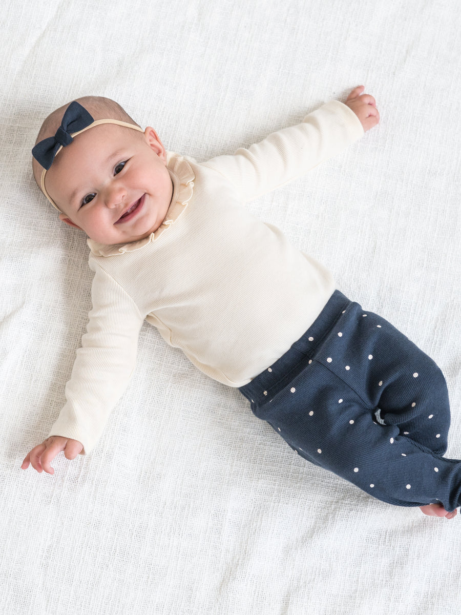 Irma Ribbed Ruffle Neck Bodysuit Sale : Baby : One Pieces : Bodysuits : Long Sleeves Kendi Organic Cotton Baby Irma Ribbed Ruffle Neck Bodysuit